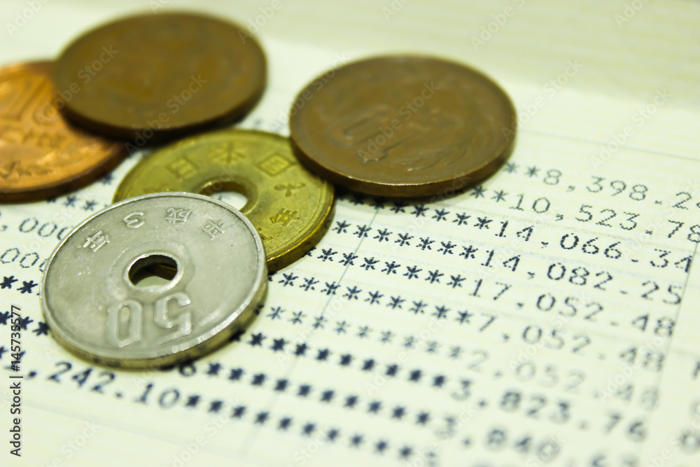 Japanese Coins on the Book Bank Background Japanese Coins on the Book Bank Background
