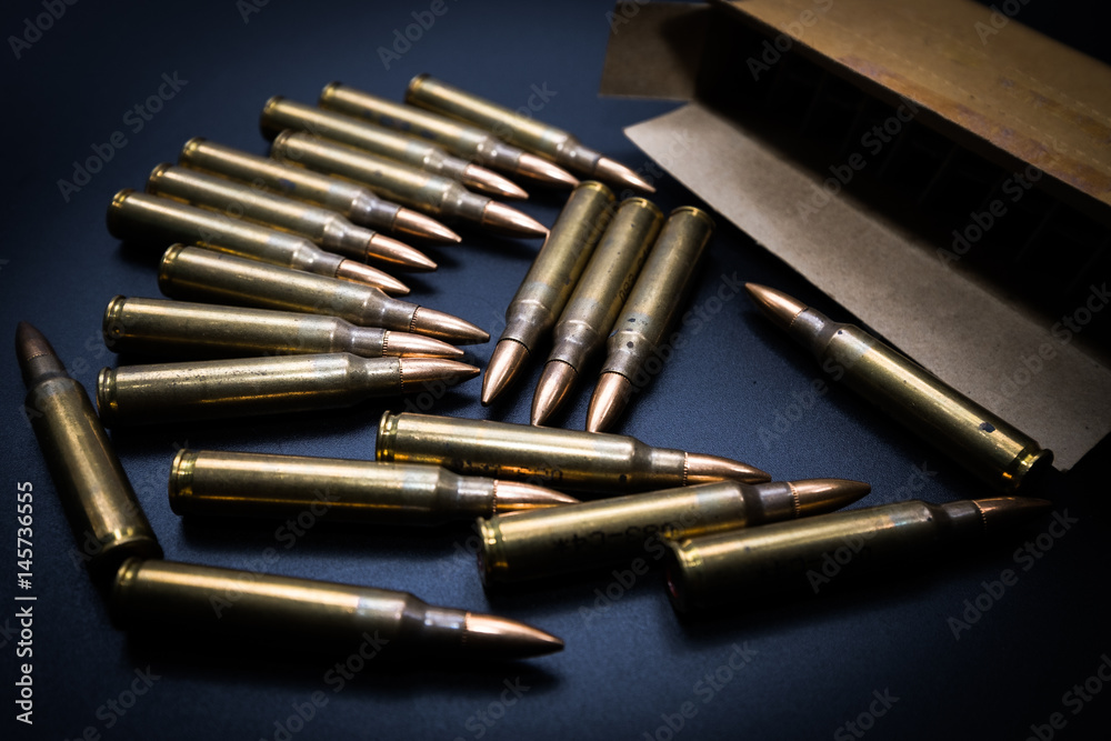 5.56 rounds and box on black background 5.56 rounds and box on black background