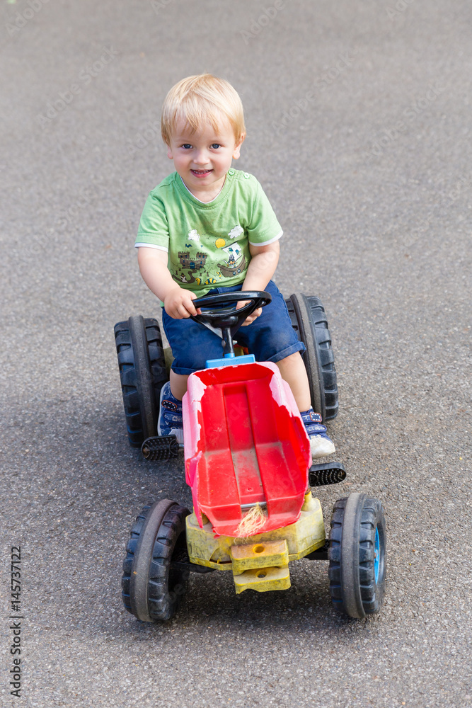 Little Boy Driving Broken Tractor Little Boy Driving Broken Tractor