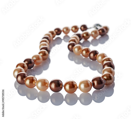 Luxury elegant golden pearl necklace close-up