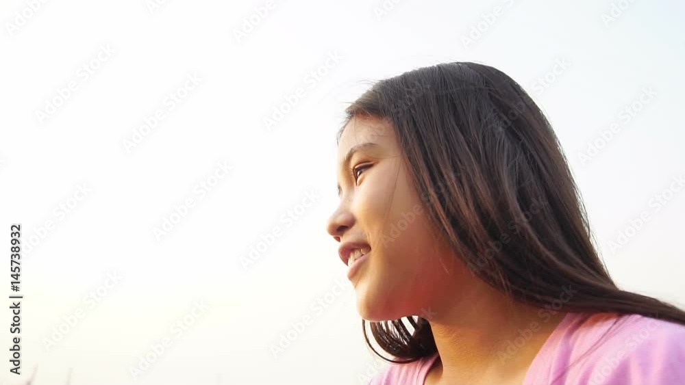 Happy little girl looking up at sky in sunset, Slow motion
Happy little girl looking up at sky in sunset, Slow motion