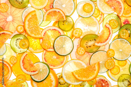 Sliced citrus fruits background.