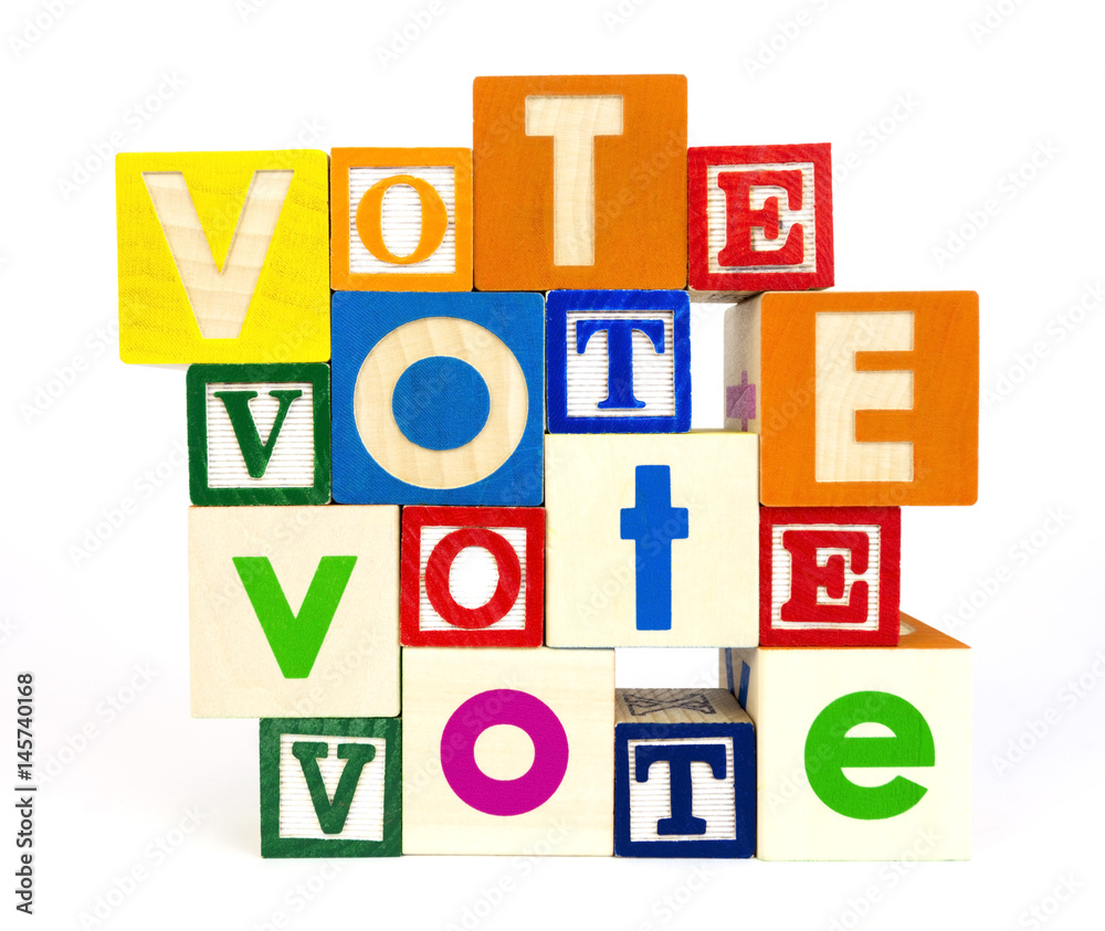 VOTE message spelled out with colorful alphabet blocks. VOTE message spelled out with colorful alphabet blocks.