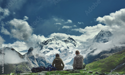 hikers on the trail in the Apls mountains. Trek near Matterhorn mount. Mountain ridge on the background © vitaliymateha