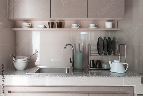 stainless steel sink with faucet on kitchen counter