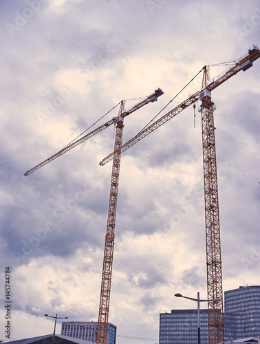 Modern housing development with cranes