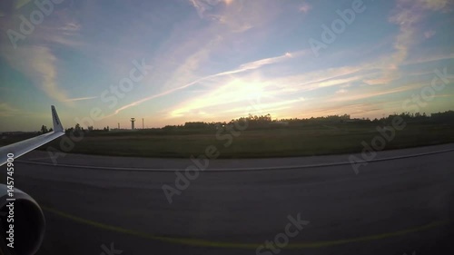March 08, 2017 - Portugal. Ryanair Boeing 737-800 takes off in City of Porto airport. View from inside at sunset time above the city and ocean.