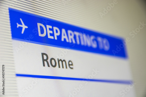 Photography Computer screen close-up of status of flight departing to Rome, Italy