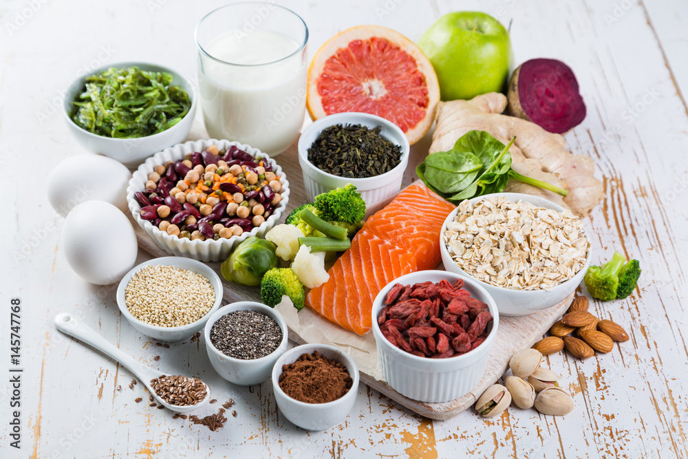 Selection of superfoods on rustic background Selection of superfoods on rustic background