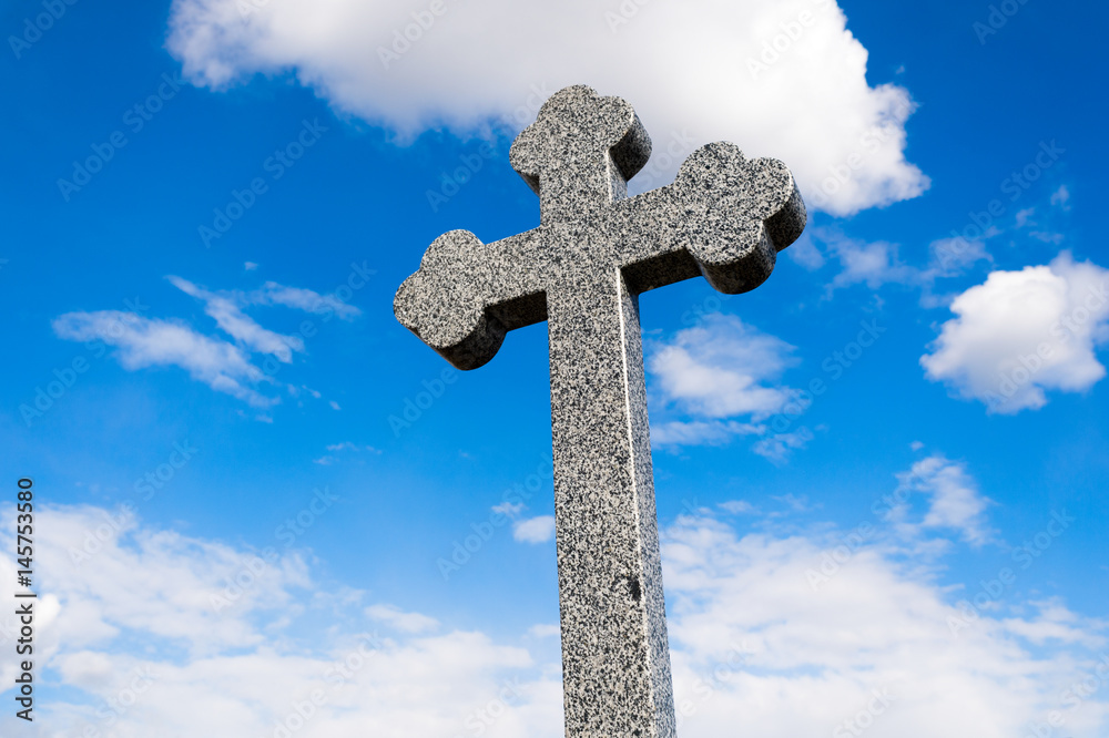 cross in the cemetery on the sky background