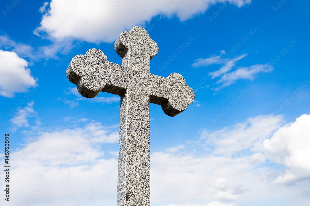 stone cross against the sky