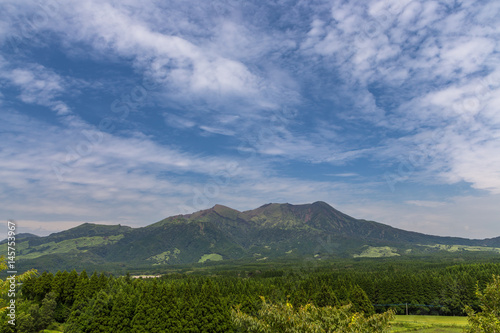 Mount Aso volcano and green field in Kumamoto, Japan