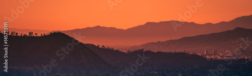 Fototapeta Sunset landscape view of silhouette mountains in Los Angeles California	
