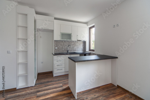 Wallpaper Mural New modern and empty white kitchen. New home. Interior photography. Wooden floor. Torontodigital.ca