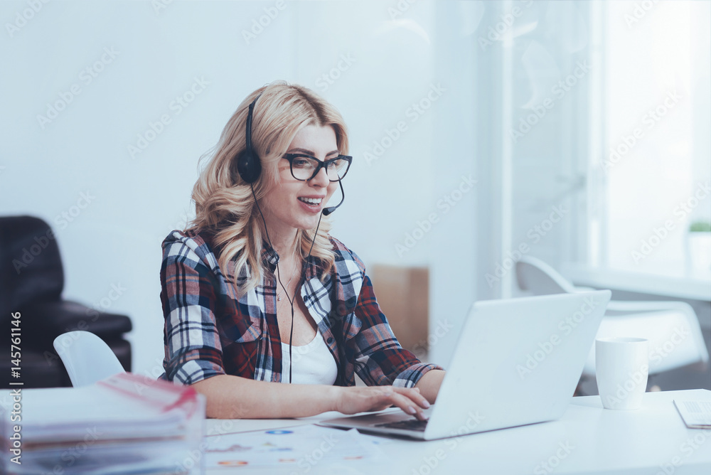 Cheerful call center operator working Cheerful call center operator working