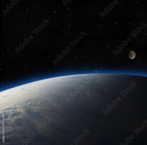 Fototapeta Naklejka Na Ścianę i Meble -  Earth overlooking the moon. Elements of this image furnished by NASA.
