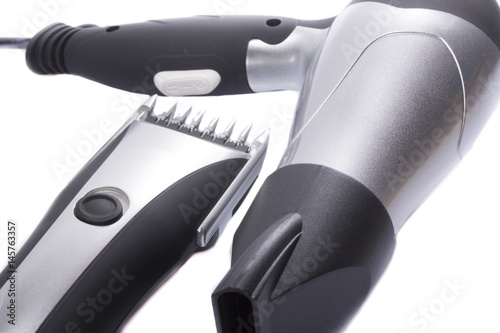 Hair dryer and trimmer on a white background