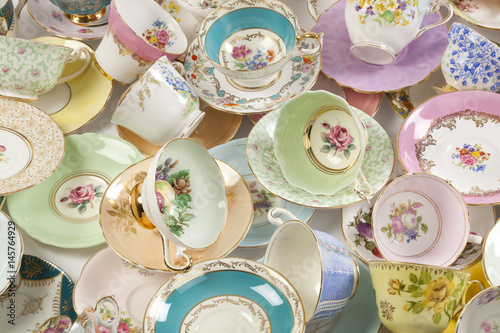 Collection of antique teacups and saucers.