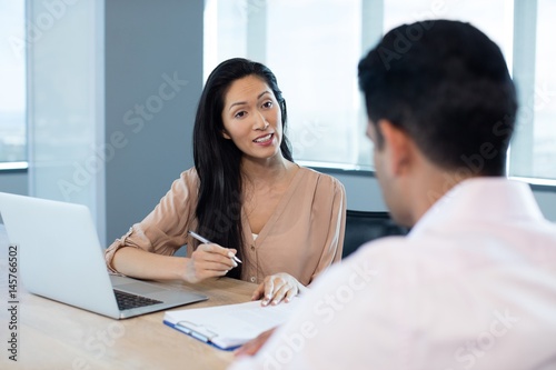 Businesswoman discussing contract 