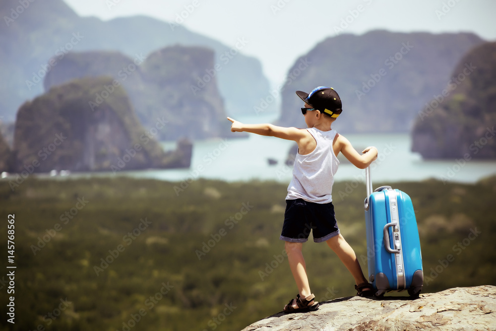 Child with baggage case travel concept