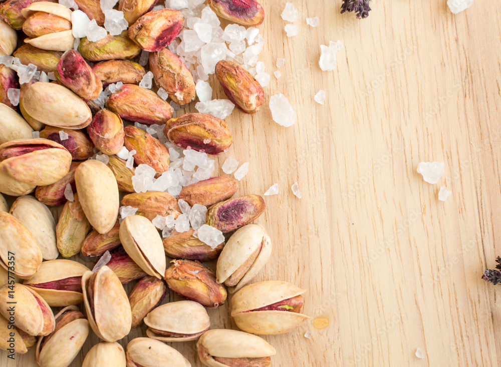 Heap of Inshell Pistachios and Peeled Pistachios with Large Salt Crystals Heap of Inshell Pistachios and Peeled Pistachios with Large Salt Crystals