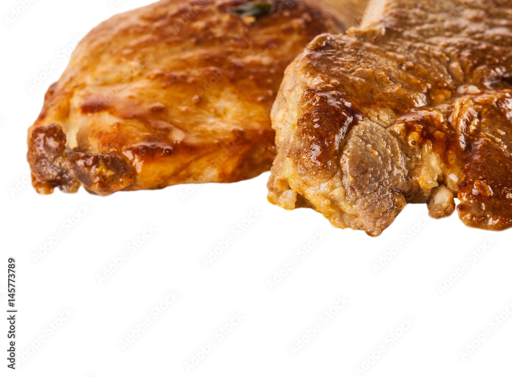 two pieces of baked meat on white background two pieces of baked meat on white background