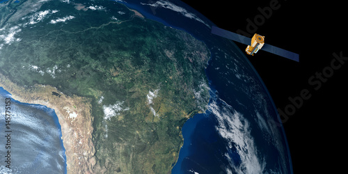 Fototapeta Naklejka Na Ścianę i Meble -  Extremely detailed and realistic high resolution 3D image of a Satellite orbiting Earth above South America. Shot from outer space. Elements of this image are furnished by NASA.