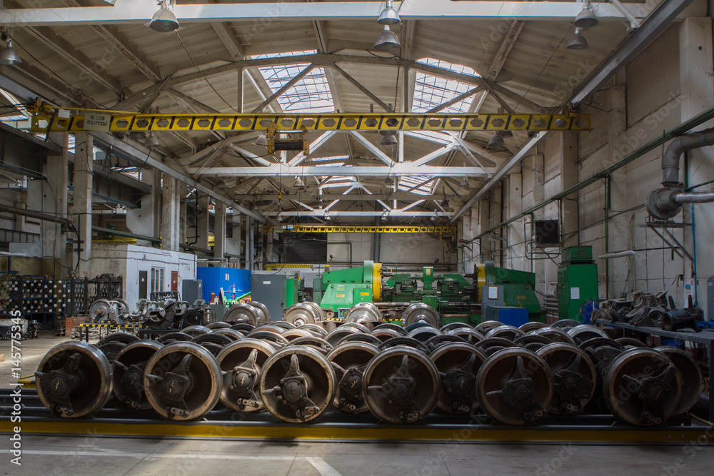 Fototapeta premium Set of steel wheels for trains. Workshop metro