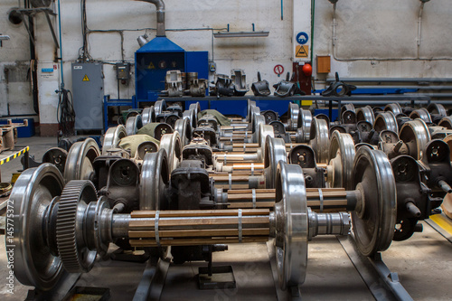 Set of steel wheels for trains. Workshop metro