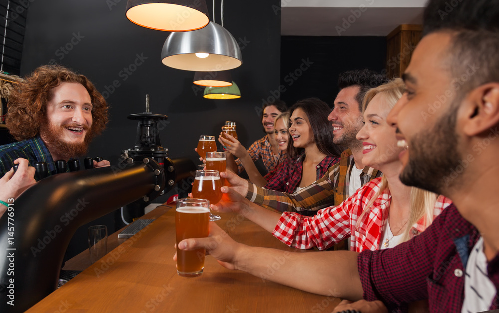 Young People Group In Bar, Barman Friends Sitting At Wooden Counter Pub, Drink Beer Communication Party Celebration