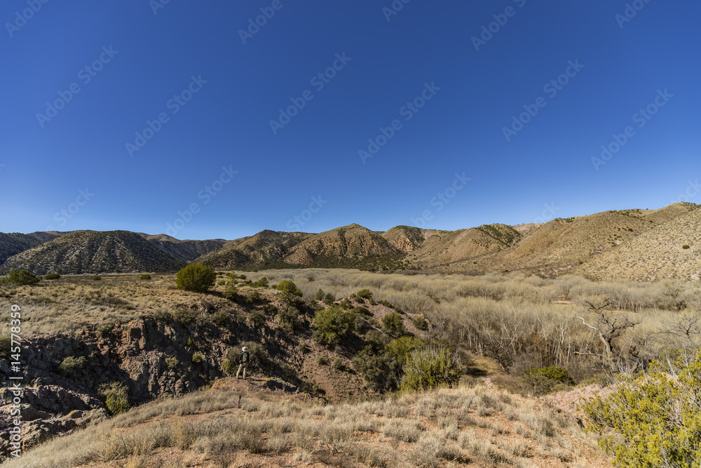 river valley and mountains in the late morning light