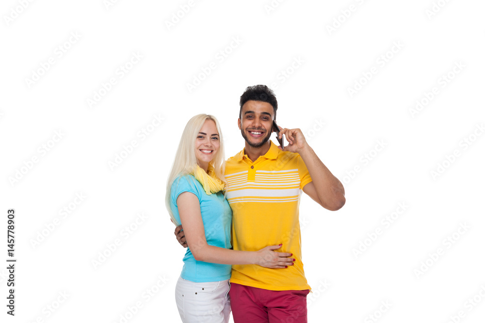 Beautiful Young Happy Couple Love Smiling Embracing, Hispanic Man Cell Smart Phone Call Talking Woman Smile Isolated Over White Background Beautiful Young Happy Couple Love Smiling Embracing, Hispanic Man Cell Smart Phone Call Talking Woman Smile Isolated Over White Background