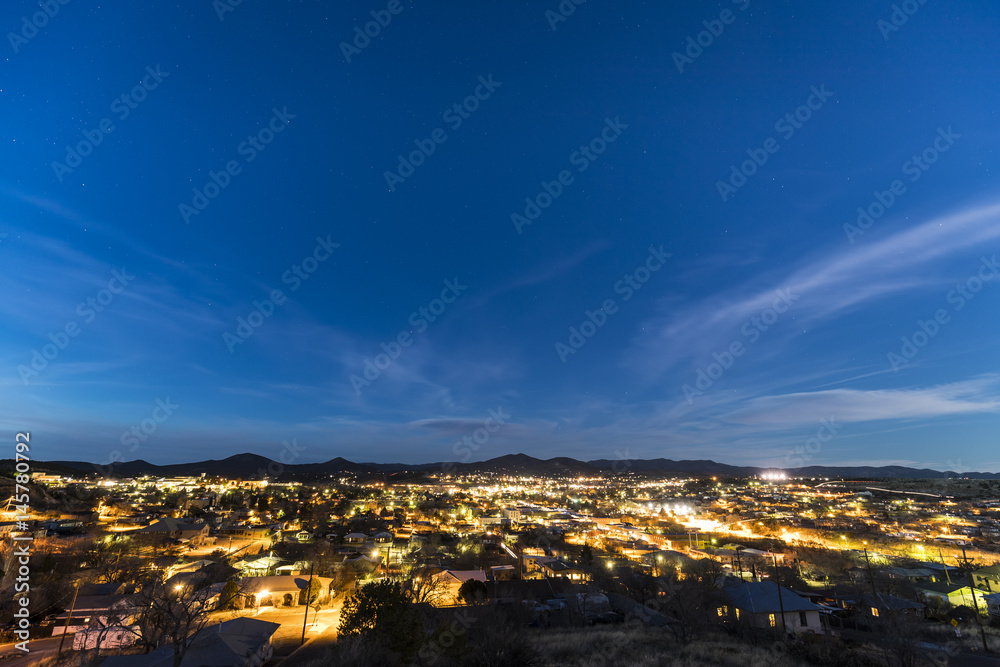 Small mountain town under the stars at night
