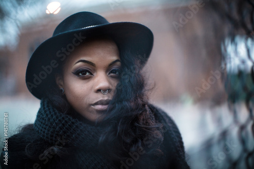 A portrait of a young, black woman, posing in the streets of Brooklyn, New York City.