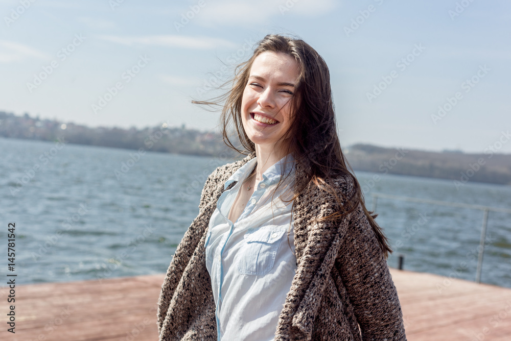 Summer portrait of happy young beautiful woman with a smile