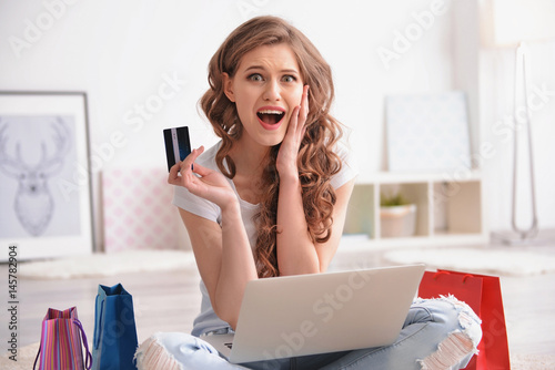 Young woman shopping online...