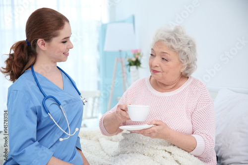 Nurse talking with elderly ...