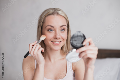 Young Woman Doing Makeup Concept