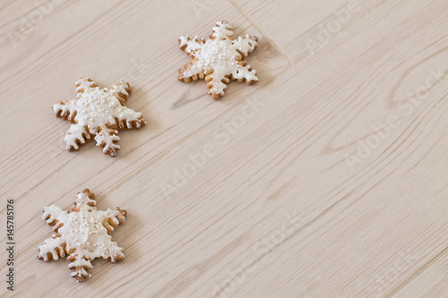 Wallpaper Mural Gingerbread snowflake on wood background. Aerial view. Copy space. Torontodigital.ca