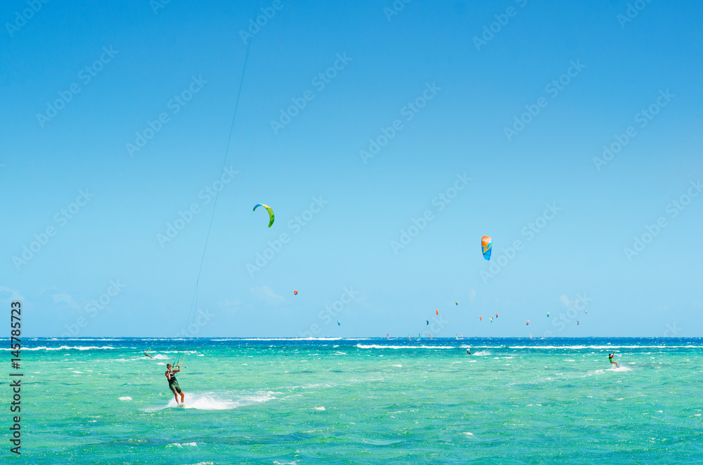 Professional kiter makes the difficult trick on a beautiful background, Mauritius Professional kiter makes the difficult trick on a beautiful background, Mauritius