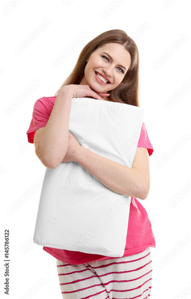 Young happy woman in pajamas hugging orthopedic pillow on light background. Healthy posture concept Young happy woman in pajamas hugging orthopedic pillow on light background. Healthy posture concept