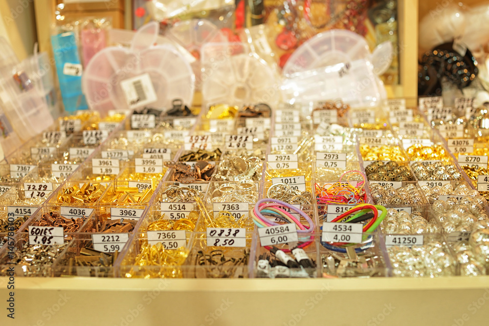 Accessories for handicraft in boxes at shop