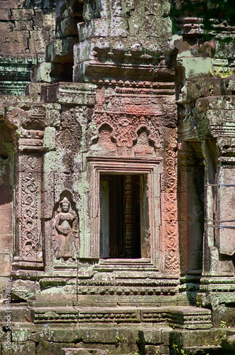 Khmer classical dancers shown in stone - An Apsara (also spelled as Apsarasa) in Banteay Kdei temple in Angkor, Siem Reap, Cambodia. photo