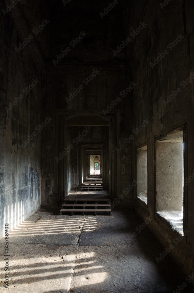Typical window balusters with a beautiful sun shadow found at Angkor Wat, Siem Riep, Cambodia