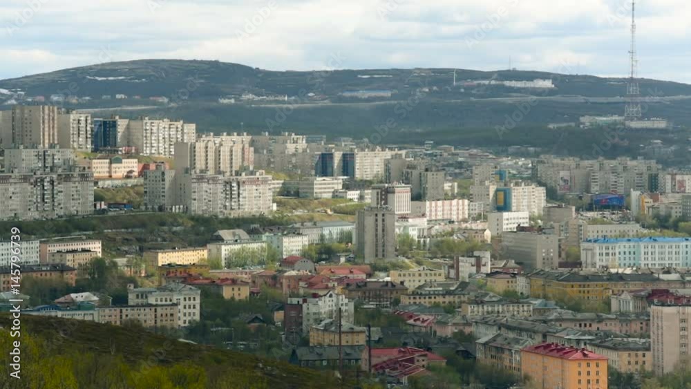 Murmansk City Center. Tall Buildings. tv Tower on Background. Wooden Houses. Green Hills Around Town. Cloudy Day. Wide Shot Murmansk City Center. Tall Buildings. tv Tower on Background. Wooden Houses. Green Hills Around Town. Cloudy Day. Wide Shot