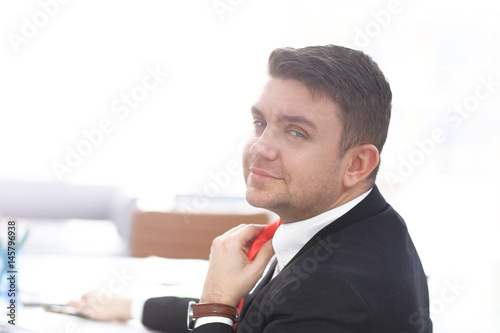 Businessman Adjust Necktie his Suit