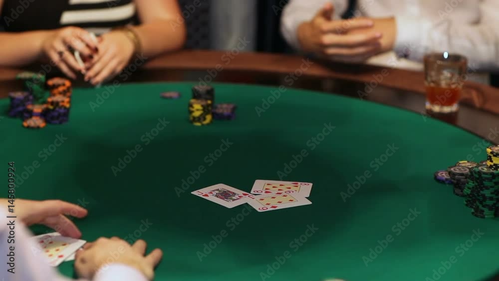 Players in the casino playing cards. poker game close-up Players in the casino playing cards. poker game close-up