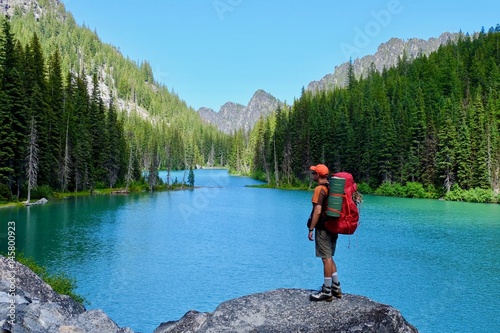 Man backpacker hiker by alpine lake. Nada Lake. The Enchantments. Cascade Mountains. North Cascades. Seattle. Leavenworth. WA. USA. 