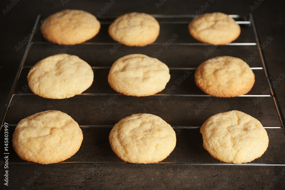 Tasty sugar cookies on grid