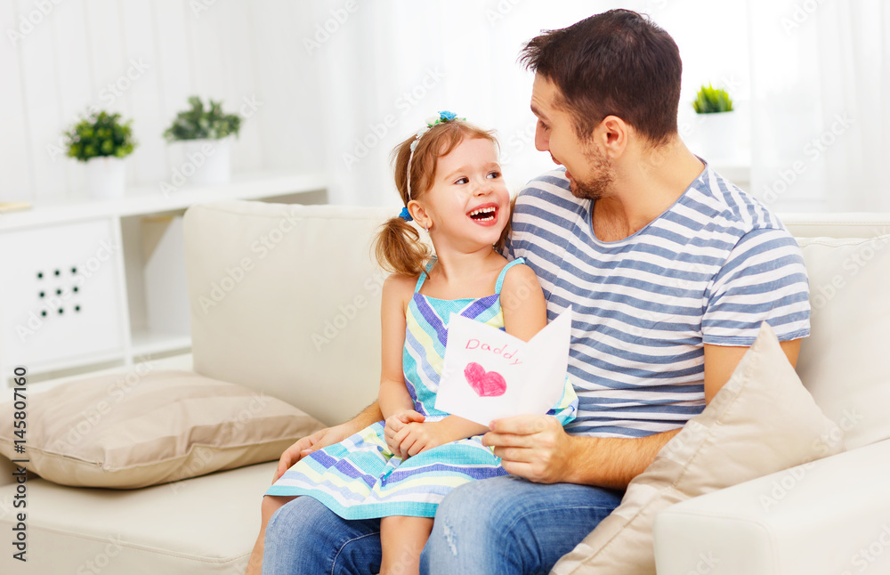 Father's day. Happy family daughter giving dad greeting card Father's day. Happy family daughter giving dad greeting card